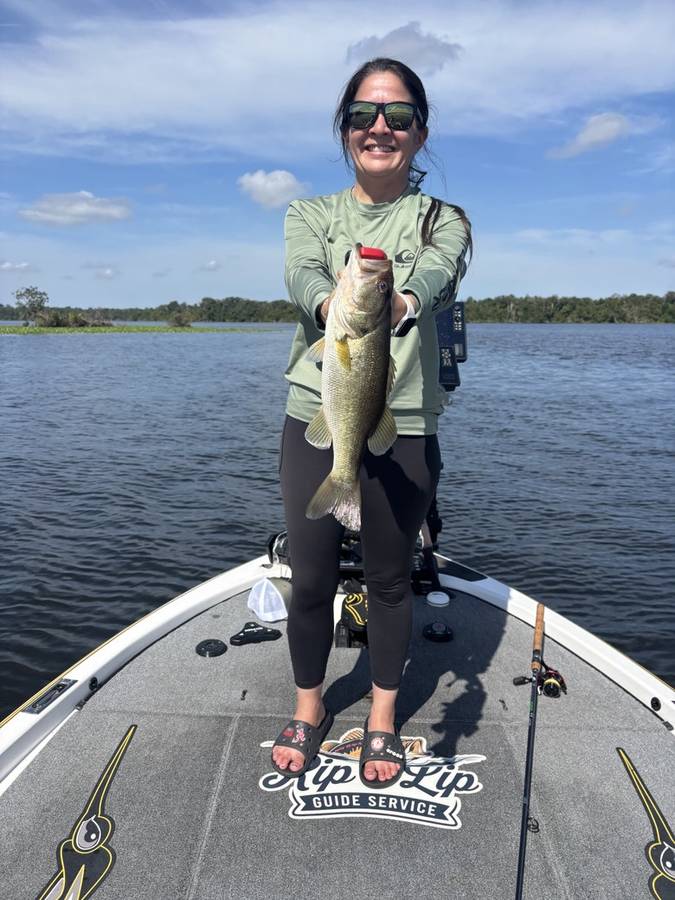 Jen with a St. Johns River largemouth on a bluebird afternoon