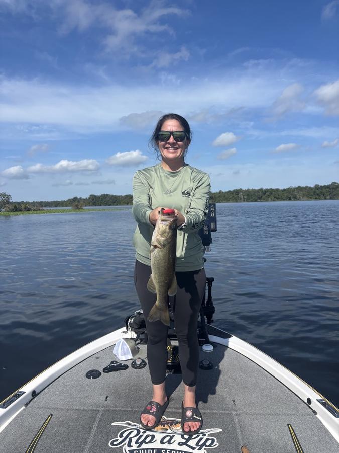 Jen with a solid largemouth from the bow of the Rip A Lip boat