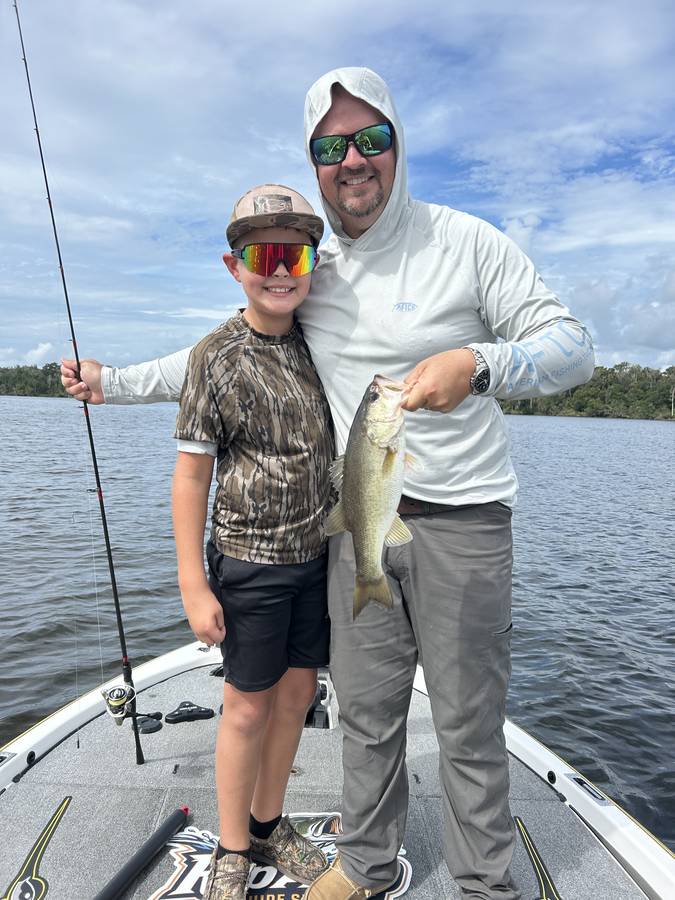 Father and son together with a St. Johns River largemouth