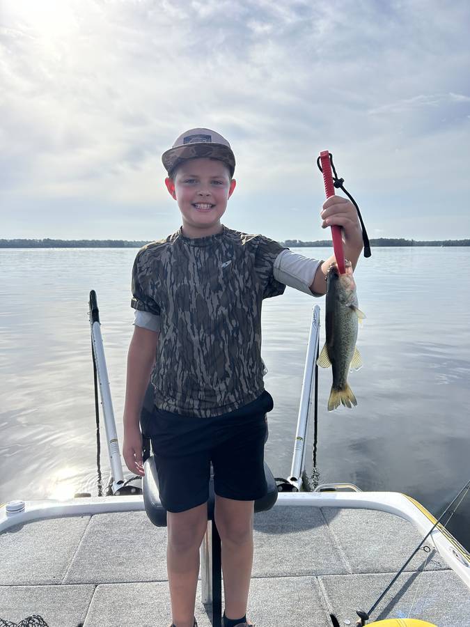 Young angler with a morning bass on the St. Johns River