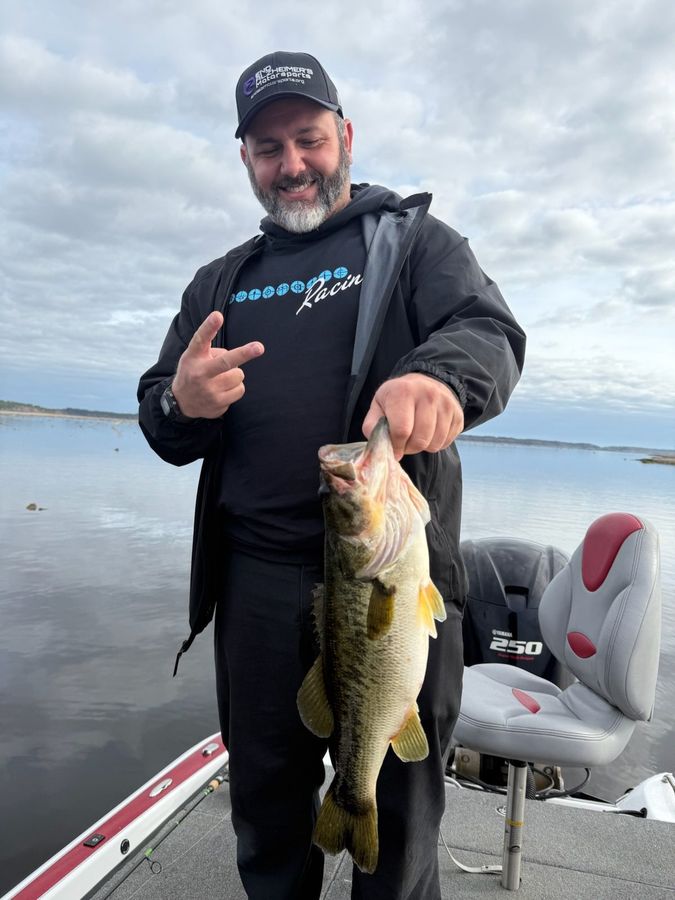 Client with a Rodman bass on a full-day wild-shiner trip