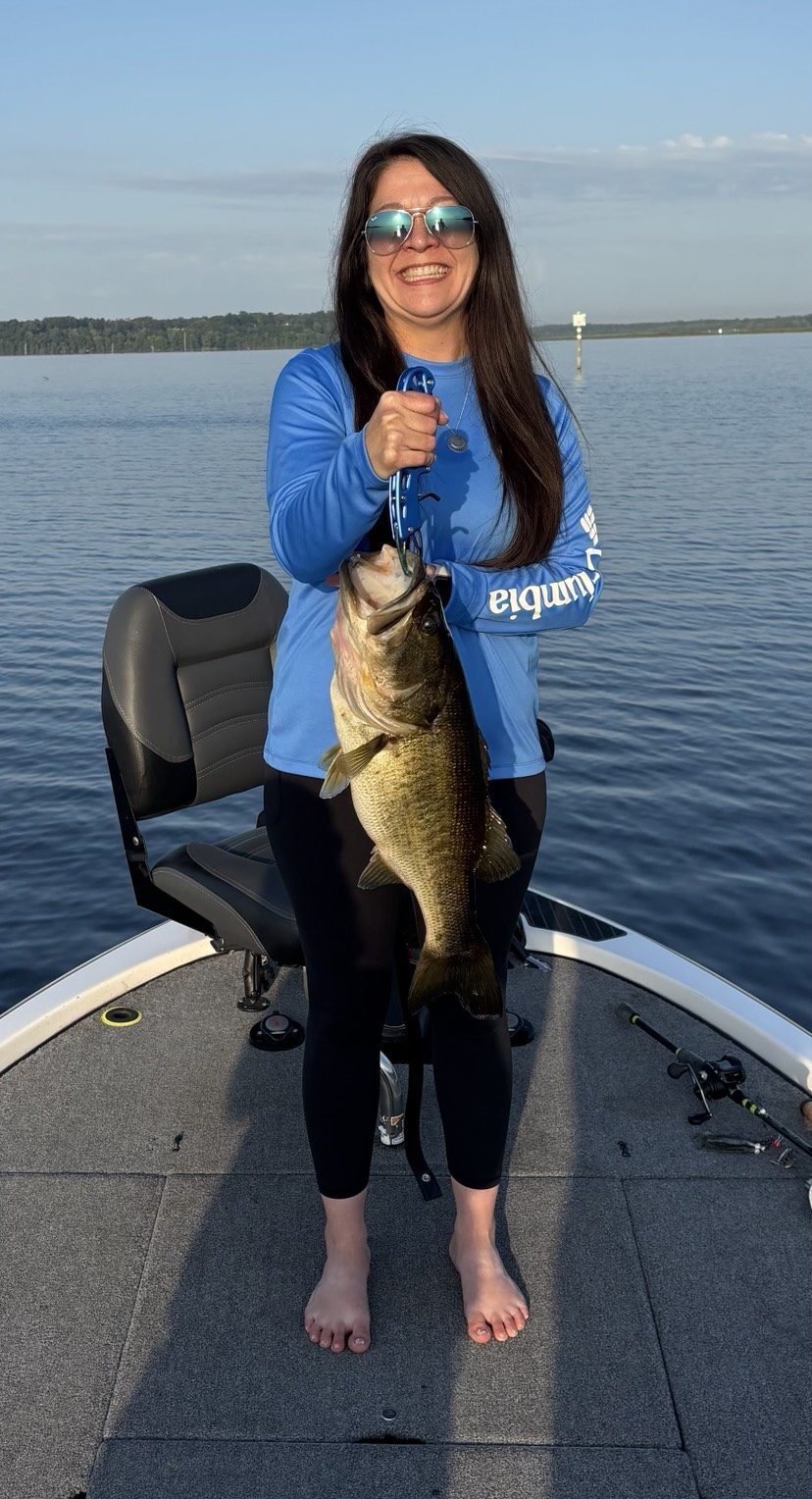Jennifer with a trophy bass on a half-day wild-shiner trip